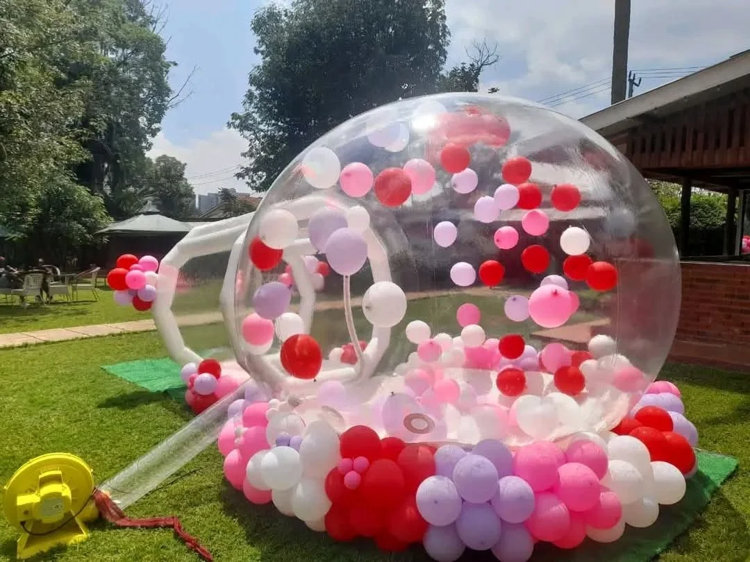 Bubble House for hire in Nairobi and Kiambu with colourful balloons inside a transparent inflatable dome for a kids birthday party by Sherehe Events & Rentals.