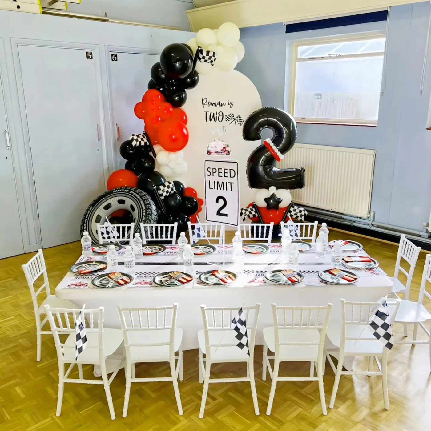 Children's birthday party setup in Nairobi with themed balloon decor, small chairs, and a party tent