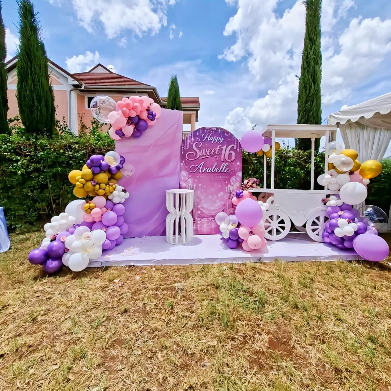 Premium themed kids birthday party setup in Nairobi with white Chiavari chairs, dressed kids tables, personalized partyware, gift boxes, and elegant birthday decorations by Sherehe Events & Rentals.